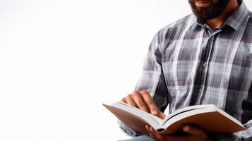 A man with a beard is reading a book photo