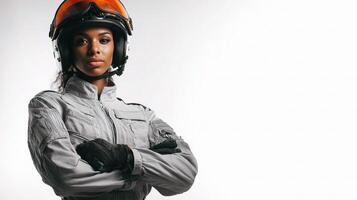 A woman in a helmet and jacket posing for a photo