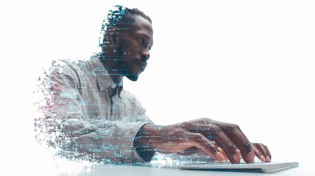 A man using a laptop computer with a digital image of him photo