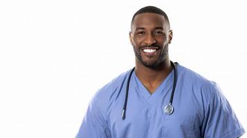 A black man in a scrub suit smiling photo