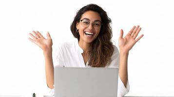 A woman with glasses and a laptop is smiling photo