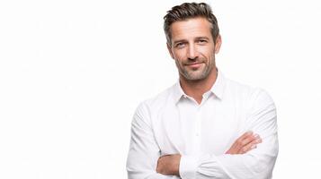 A man in a white shirt is standing with his arms crossed photo