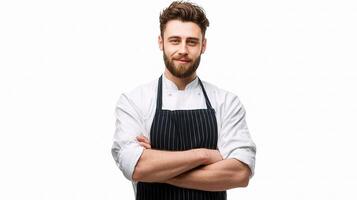 A man with a beard and apron is standing with his arms crossed photo