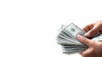 A person holding a stack of money in their hand photo