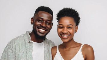 A young couple smiling and posing for the camera photo