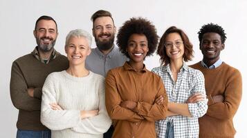 Group of people standing together with arms crossed photo