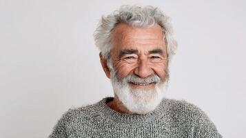An older man with a grey beard and white hair photo