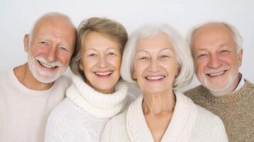 Three older people are smiling and looking at the camera photo