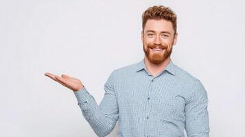 A man with red hair and beard is holding something photo