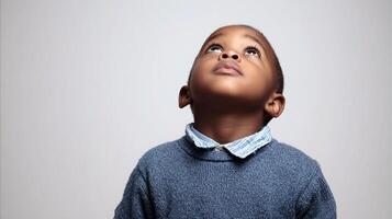 A young boy looking up at something photo