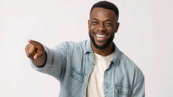 A smiling black man pointing at something photo