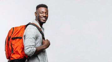 A smiling young man with a backpack photo