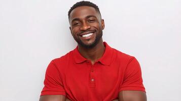 A smiling black man in a red shirt photo