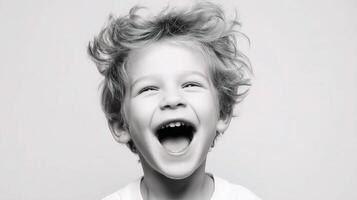 A young boy is laughing and smiling photo