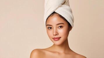 Beautiful asian woman with towel on head photo