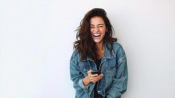 A woman in a denim jacket laughing photo