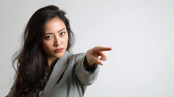 Asian woman pointing at something photo