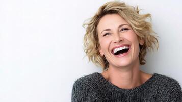Joyful Middle-Aged Woman Laughing Freely in Relaxed Setting photo