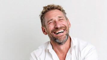 A man laughing with his eyes closed photo
