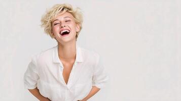A woman is laughing while standing on her hands photo