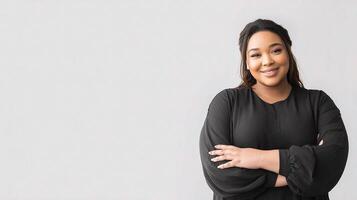 A woman in black shirt standing with arms crossed photo