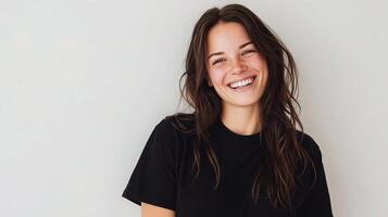 A woman is smiling and wearing a black shirt photo