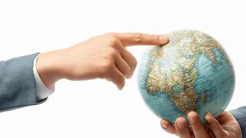 Two hands pointing at a globe on a white background photo