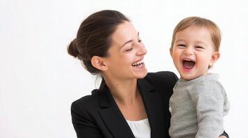 A woman holding a baby and laughing photo
