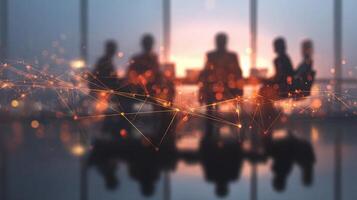 Business people sitting at a conference table with a network connection photo