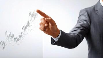 A man in a suit pointing at a graph on a screen photo