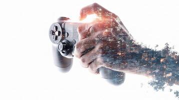 A hand holding a game controller photo