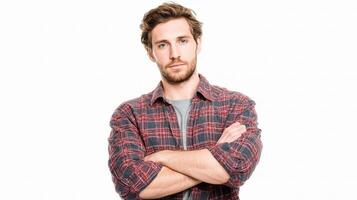 A man in a plaid shirt with his arms crossed photo