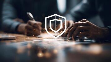 Business people working on a project with a shield logo photo