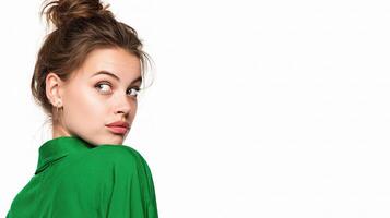 A woman in a green shirt looking up photo