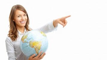 A woman holding a globe pointing at something photo