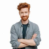 A man with red hair and beard standing with his arms crossed photo