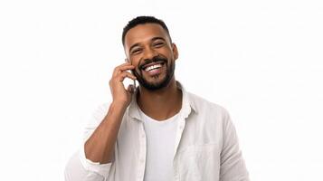 A man is smiling while talking on his cell phone photo