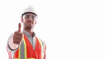 A man in a hard hat and safety vest giving the thumbs up photo