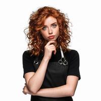 A woman with red hair and a black apron photo