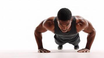 Male Trainer Demonstrating Push-Up Exercise with White Backdrop photo