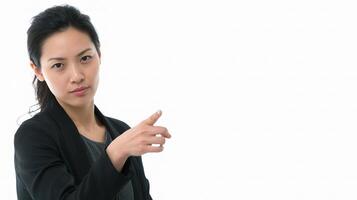 Serious Asian Businesswoman Pointing to the Side for Presentation photo