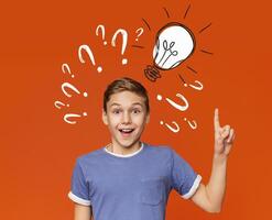 Teenage genius finding brilliant solution to difficult problem, looking happy and pointing at light bulb, collage. Inspired adolescent boy solving hard task, making innovative decision photo