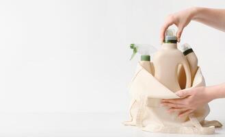 Let us save the world with using non sulfate cleaning detergents, eco friendly tools, white background, copy space photo