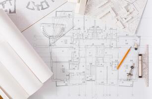 Workplace of architect. Engineering tools for creating new architectural project on table, top view photo