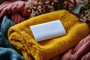 Cozy Autumn Knitwear Display with Blank Label for Mockup and Branding Design photo