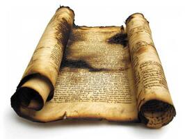 Ancient scroll with burnt edges displaying historical text photo