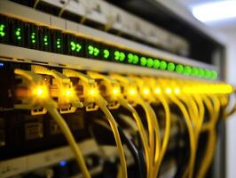 Networking equipment with illuminated connections in a server room photo