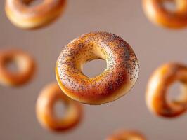 Floating bagels with poppy seeds create a whimsical display photo