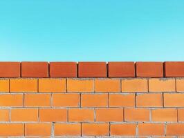 Bright blue sky over a well-constructed brick wall in daytime photo