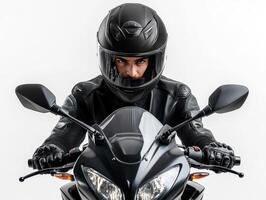Rider in black helmet focuses on motorcycle in studio setting photo